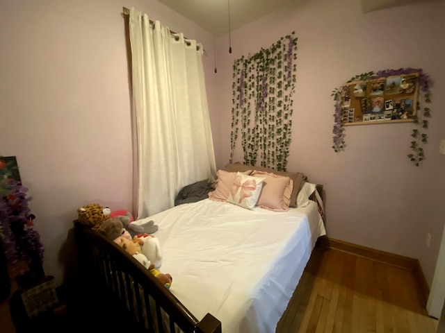 bedroom featuring wood-type flooring