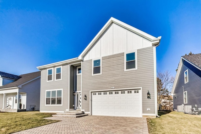 view of front of home featuring a garage and a front lawn