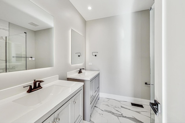 bathroom featuring vanity and a shower with shower door