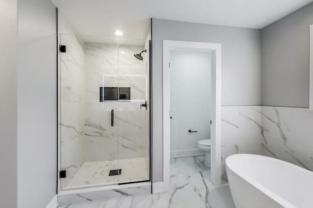 bathroom featuring shower with separate bathtub and toilet