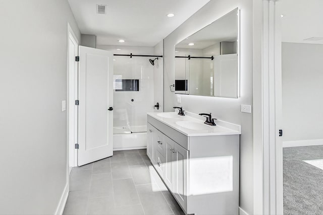 bathroom featuring tile patterned floors, vanity, and shower / bath combination with glass door