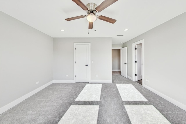 unfurnished bedroom featuring carpet and ceiling fan