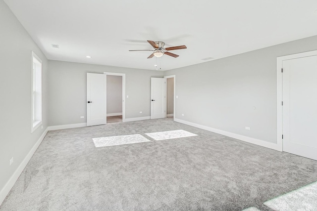 unfurnished bedroom with ceiling fan and light carpet