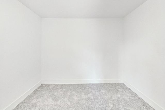 empty room with carpet flooring