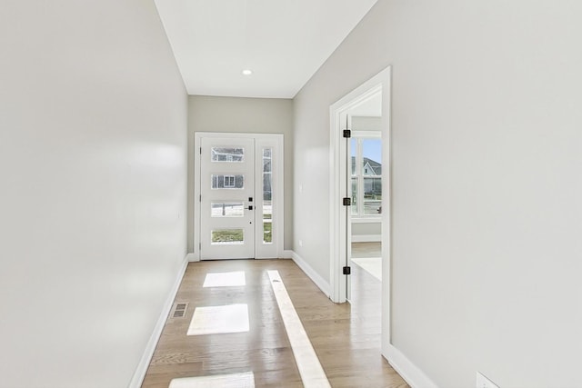 doorway to outside featuring light hardwood / wood-style flooring