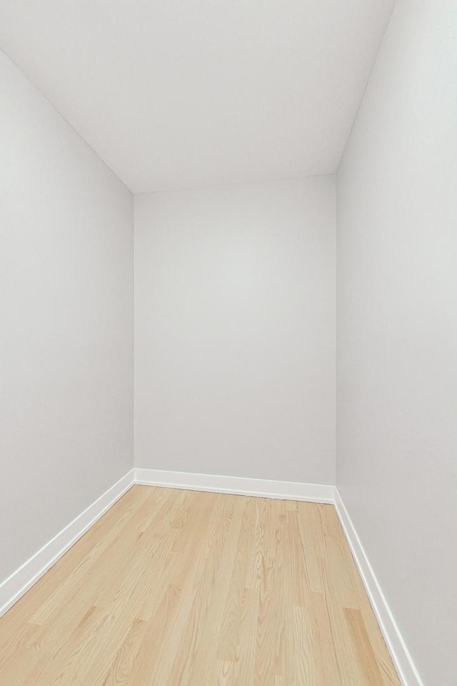 empty room with light hardwood / wood-style floors