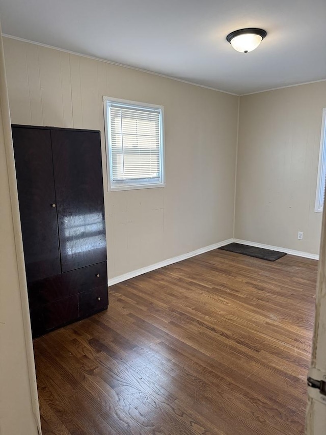 spare room featuring dark hardwood / wood-style flooring