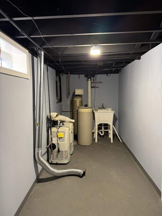 basement with electric panel and sink