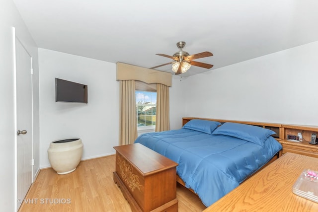 bedroom featuring light wood-type flooring and ceiling fan