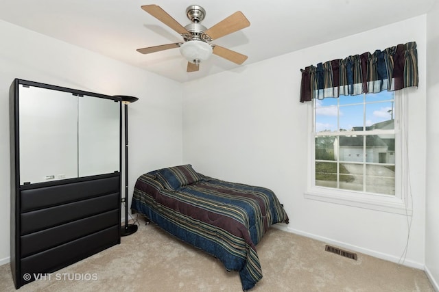 carpeted bedroom with ceiling fan