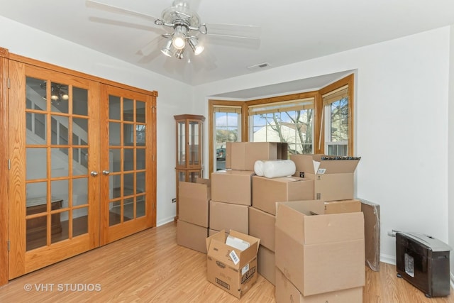 interior space featuring ceiling fan and french doors