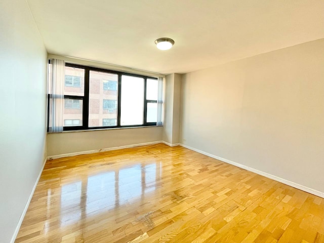 spare room featuring hardwood / wood-style floors