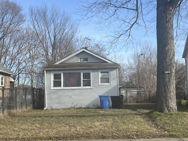 view of side of property featuring a yard