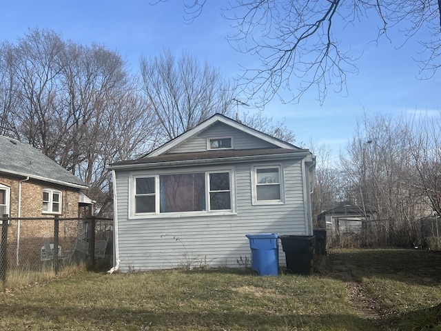 view of property exterior featuring a lawn