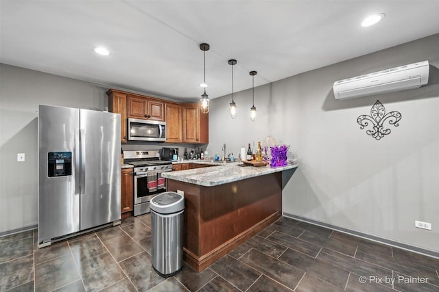 kitchen featuring light stone countertops, hanging light fixtures, stainless steel appliances, a wall mounted AC, and kitchen peninsula