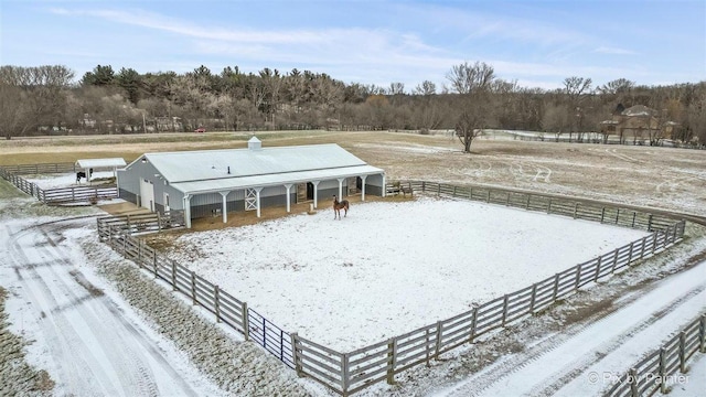 exterior space featuring a rural view and an outdoor structure