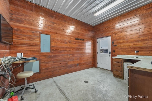 office area with electric panel and wood walls