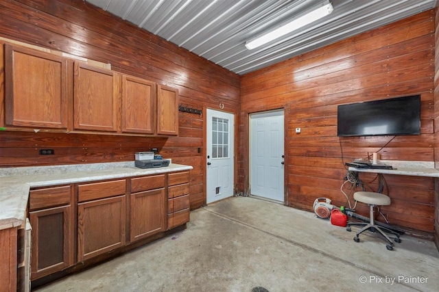 kitchen featuring wooden walls