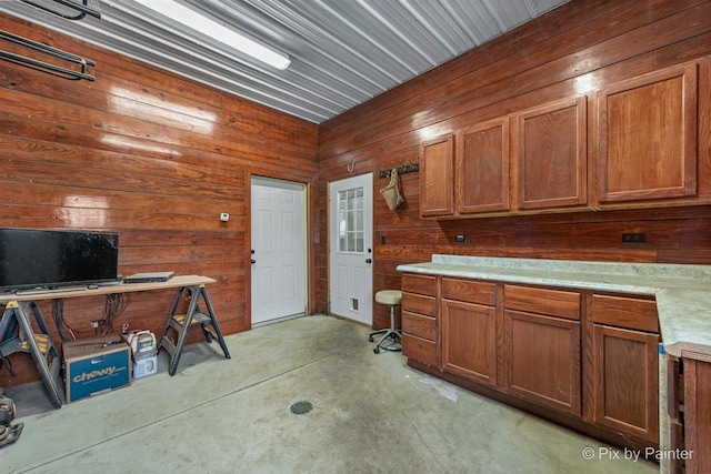 kitchen featuring wood walls