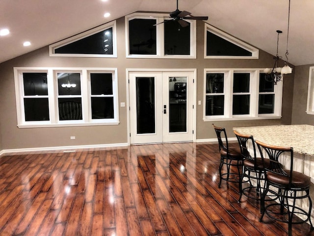 interior space with a bar and ceiling fan