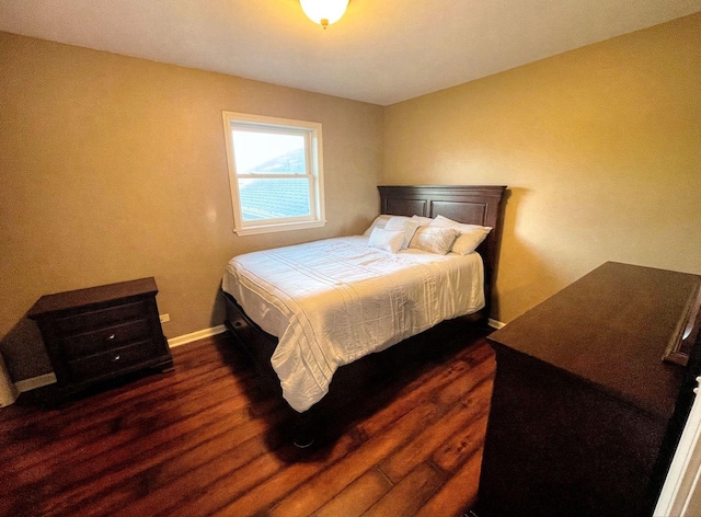 bedroom featuring dark hardwood / wood-style floors