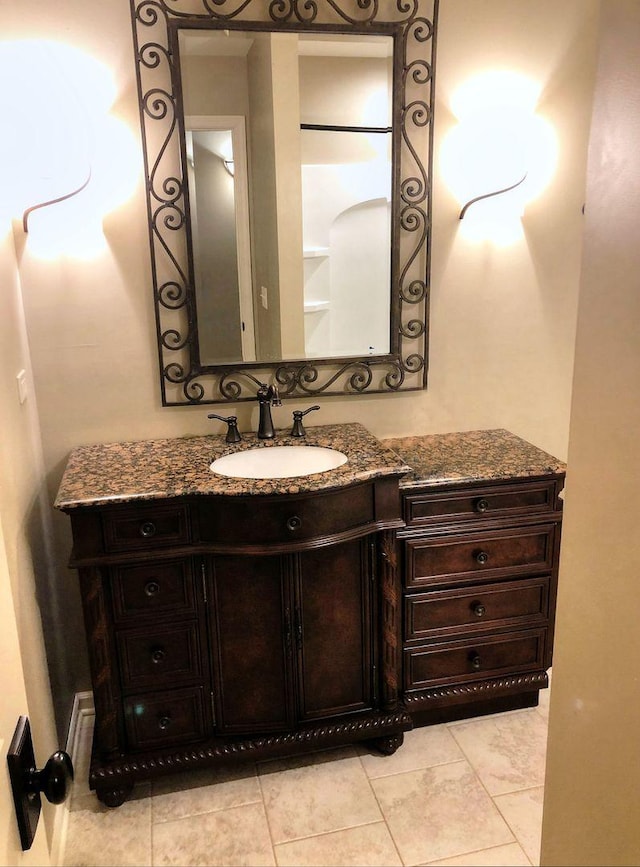 bathroom with tile patterned flooring and vanity