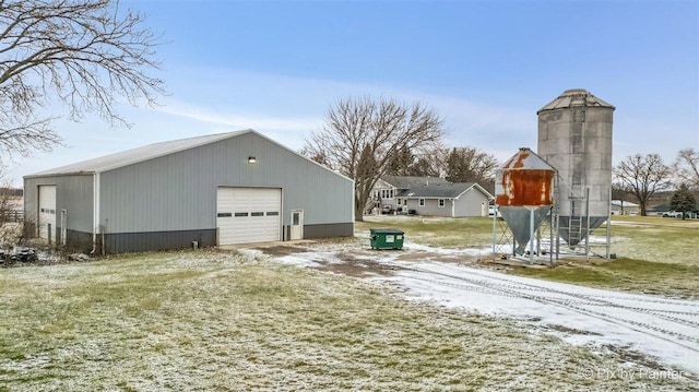 exterior space featuring a garage and an outdoor structure