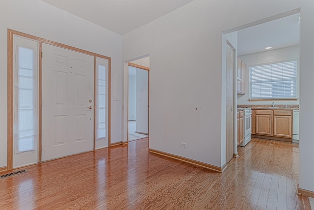 entryway featuring light hardwood / wood-style flooring and sink