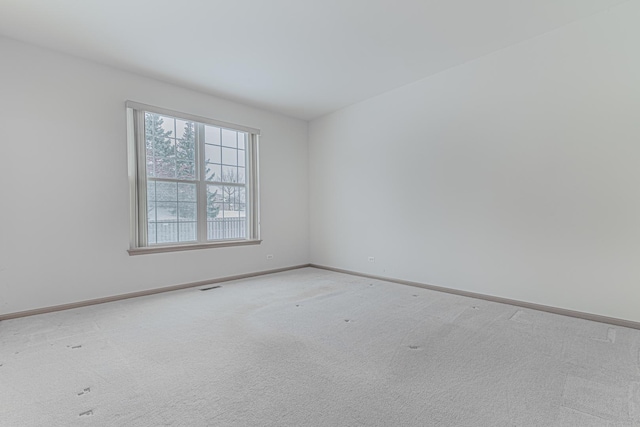 empty room with carpet flooring