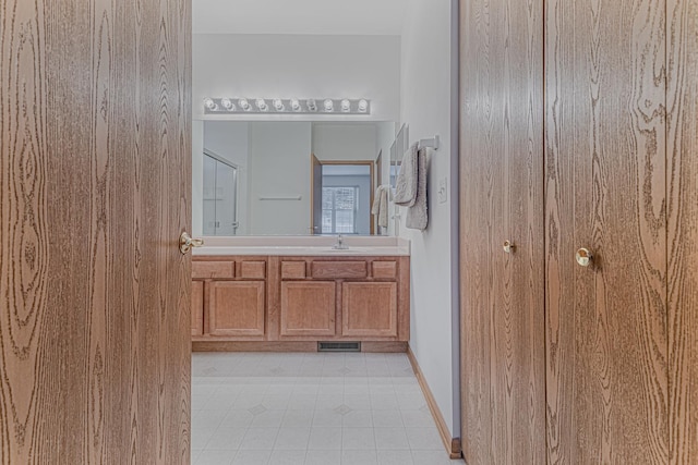 bathroom featuring tile patterned floors and vanity