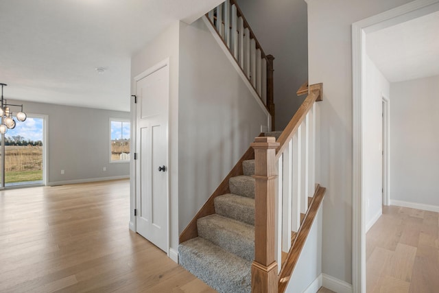 507 Wheatley Dr, Mahomet, IL 61853 - stairs with baseboards and wood finished floors