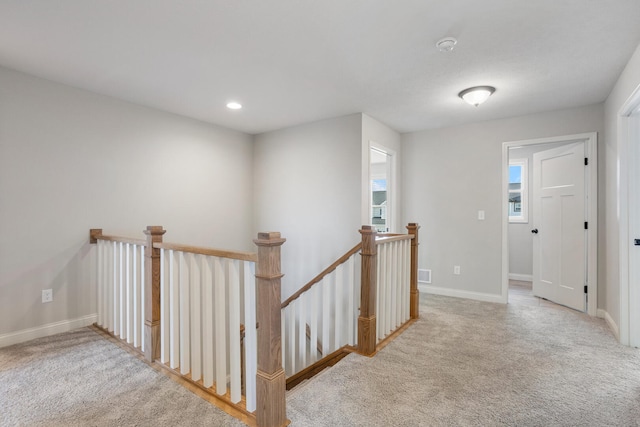 507 Wheatley Dr, Mahomet, IL 61853 - hallway with baseboards, carpet floors, and an upstairs landing