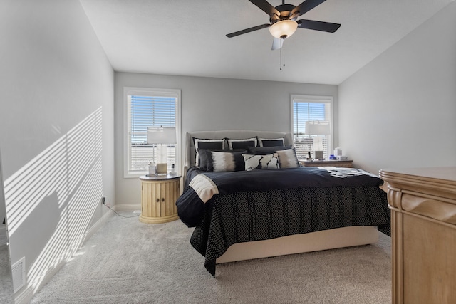 bedroom featuring ceiling fan, carpet floors, and lofted ceiling