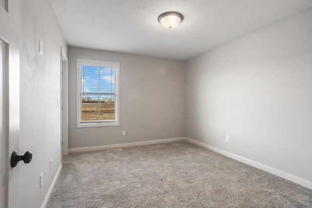 507 Wheatley Dr, Mahomet, IL 61853 - unfurnished room with carpet floors and baseboards