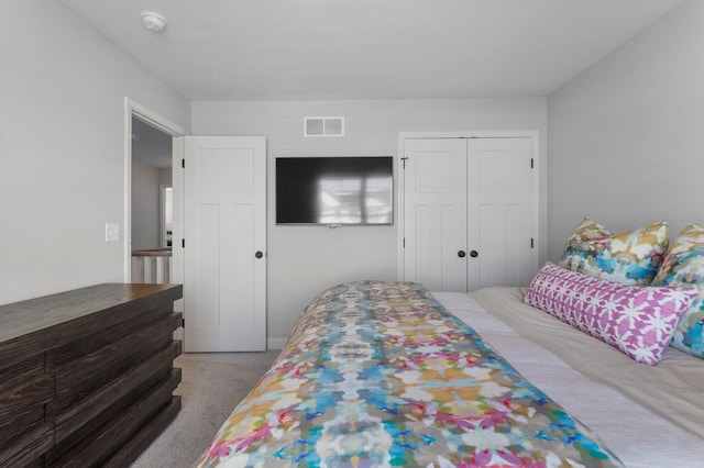 carpeted bedroom featuring a closet