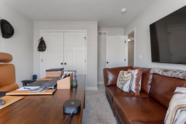 living room featuring light colored carpet