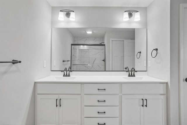 507 Wheatley Dr, Mahomet, IL 61853 - bathroom with a marble finish shower, double vanity, and a sink