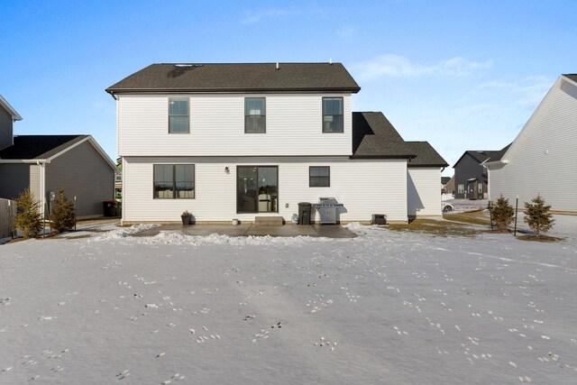 view of snow covered property