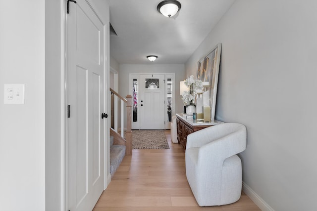 foyer entrance with light wood-type flooring