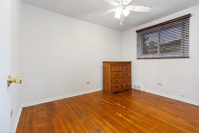 empty room with hardwood / wood-style flooring and ceiling fan