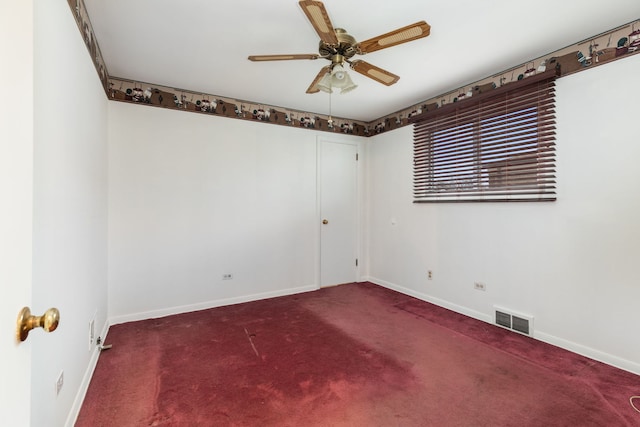 empty room with ceiling fan and carpet floors