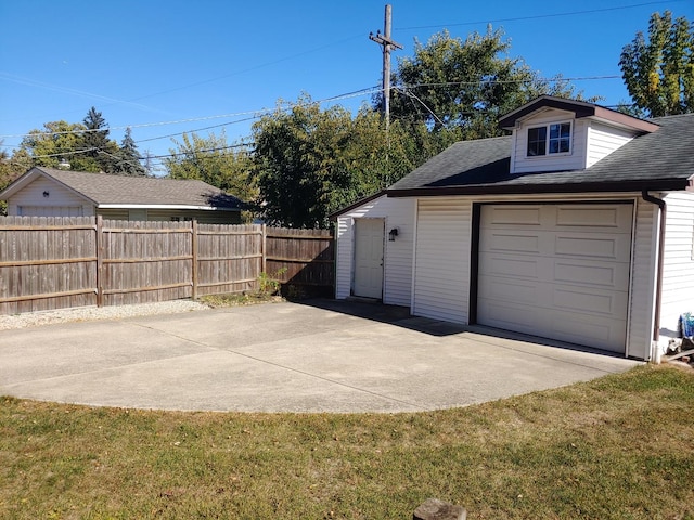 garage with a yard