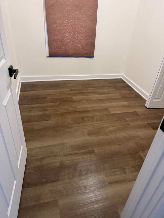 empty room featuring dark hardwood / wood-style floors