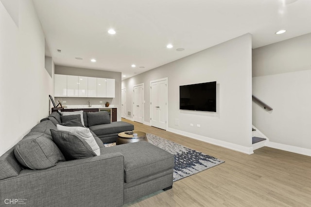 living room with light hardwood / wood-style flooring