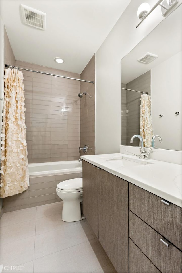 full bathroom featuring tile patterned floors, shower / bath combo, toilet, and vanity