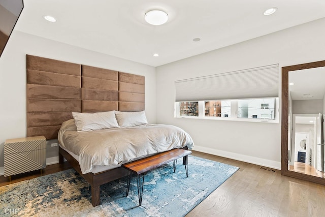 bedroom featuring wood-type flooring