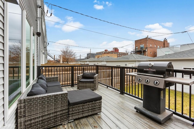 wooden deck featuring grilling area