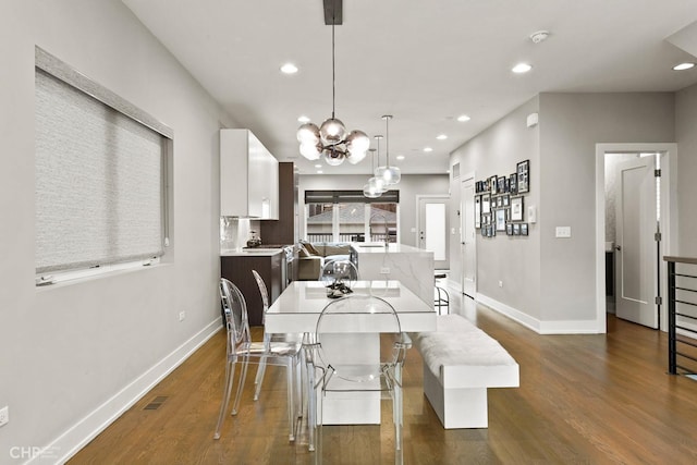 dining room with dark hardwood / wood-style floors