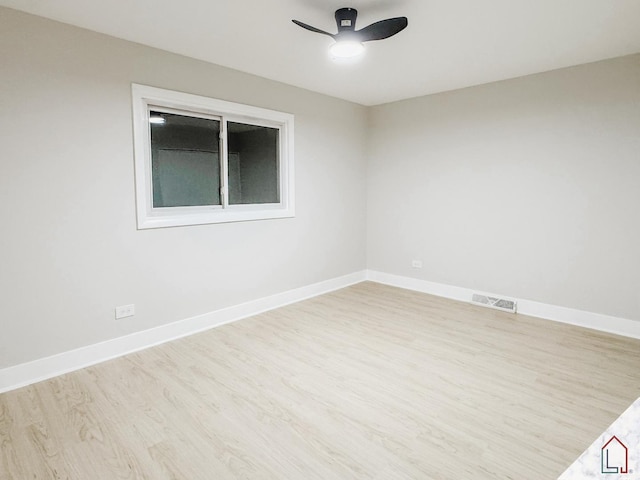 empty room featuring light wood-type flooring and ceiling fan