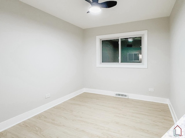 unfurnished room featuring light wood-type flooring and ceiling fan